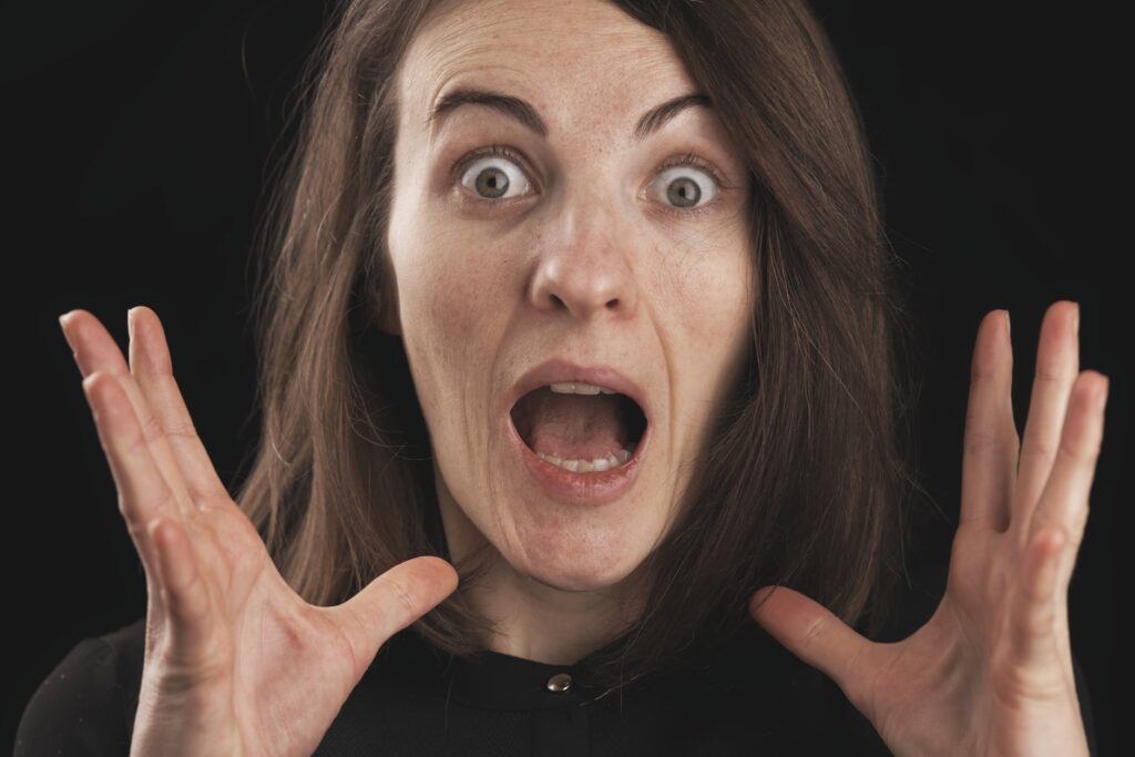 close up photo of shocked woman