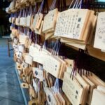 rows of various wooden shinto wish boards